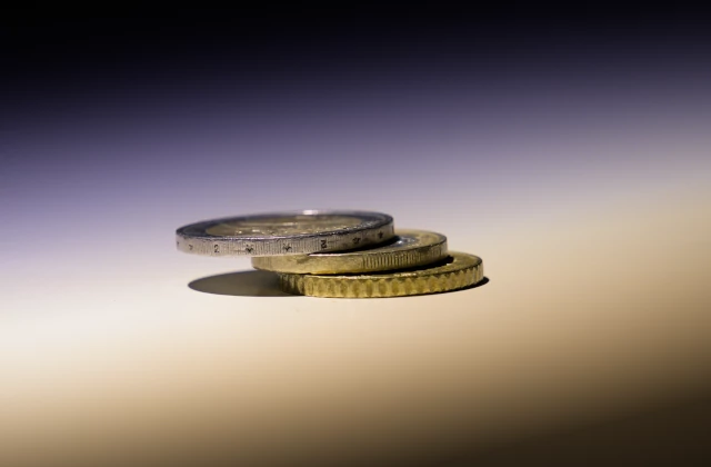 Artistic photo of three Euro coins, one on another